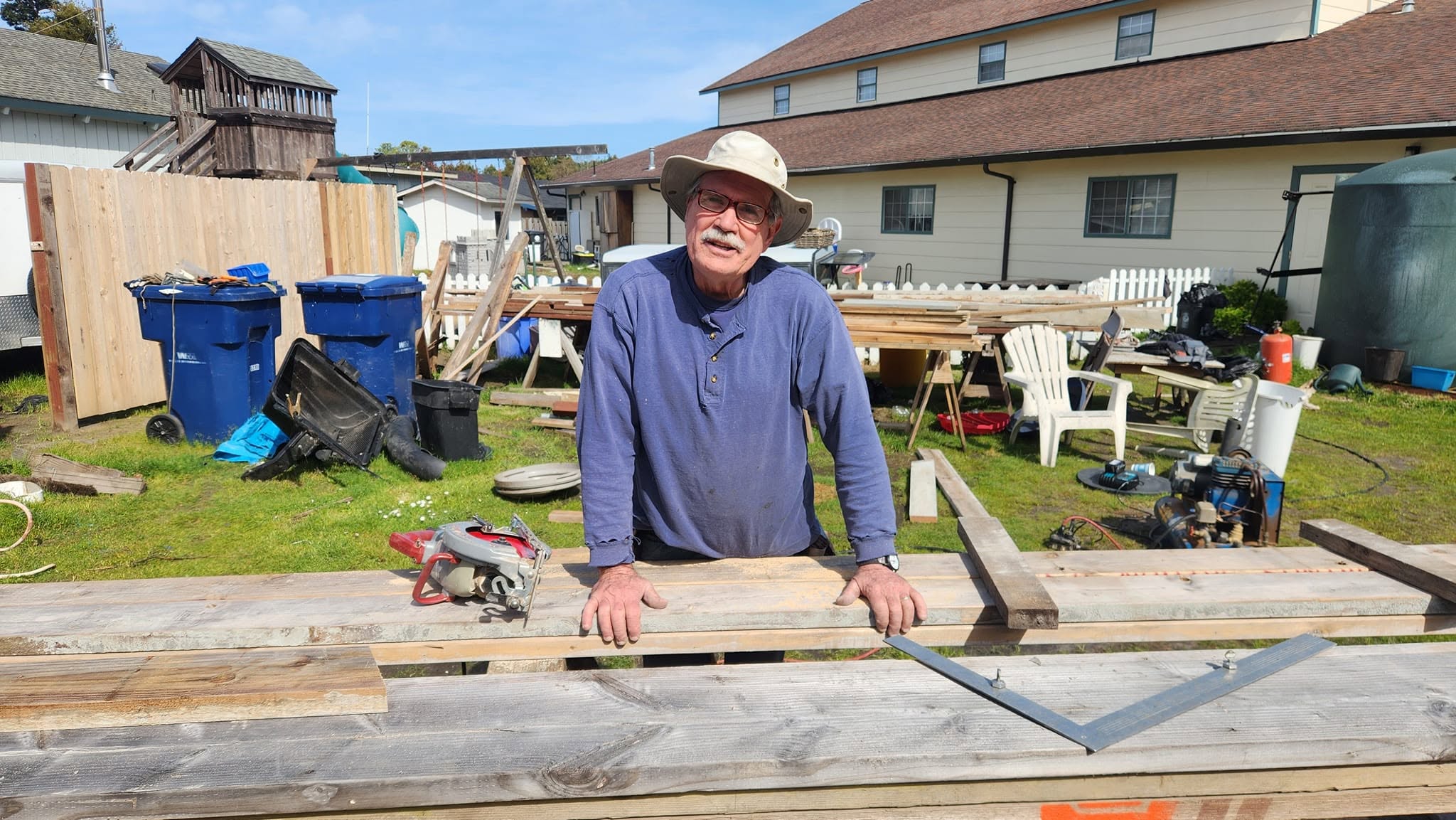 Church member working with lumber and carpentry tools
