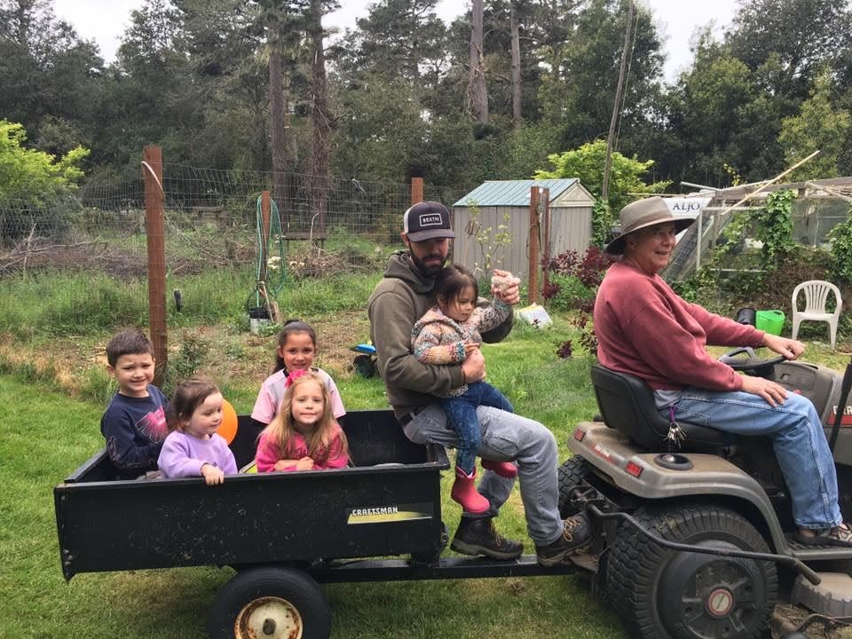 Children enjoying a tractor ride on the church property